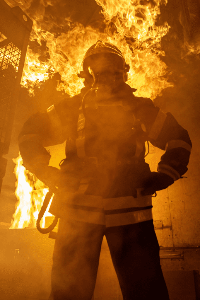 a firefighter in front of the fire