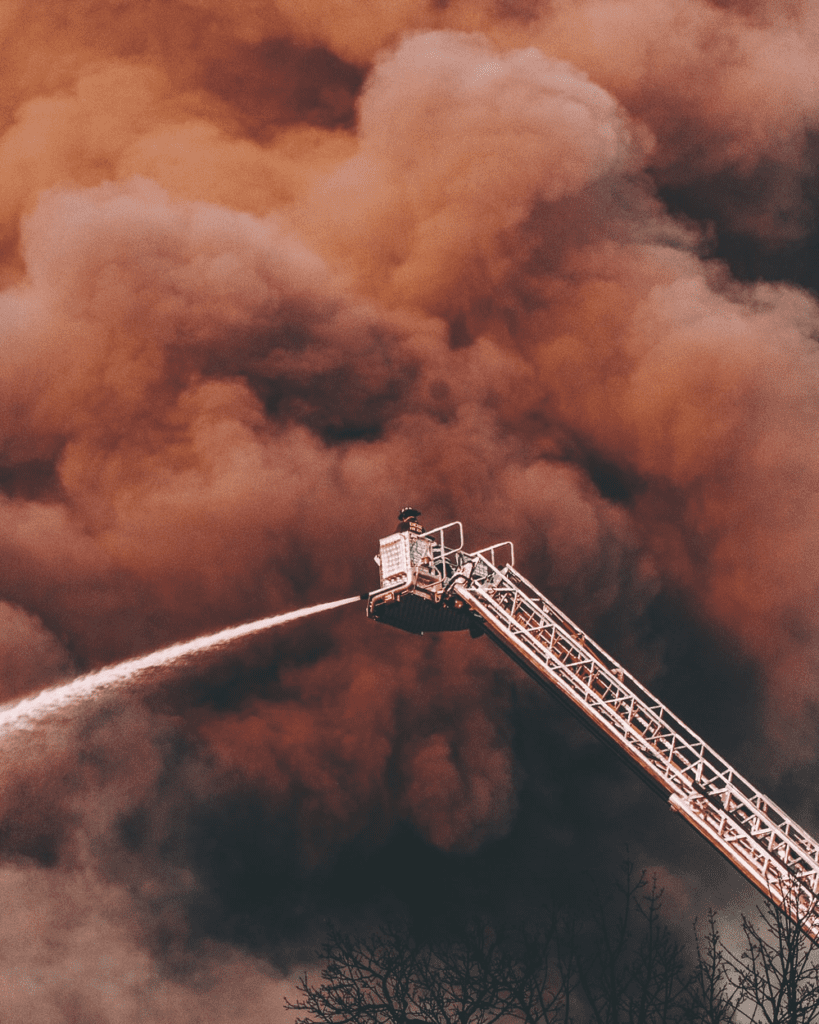 a firefighter on a crane